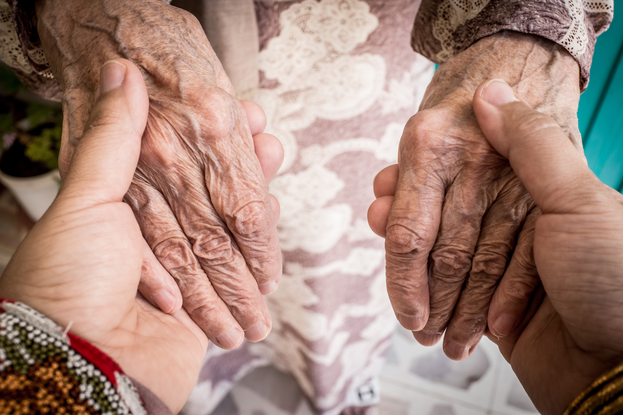 Woman taking care of elderly lady