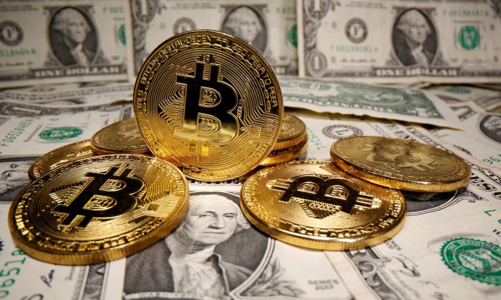 Imagem Ilustrando a Notícia: Após Biden anunciar estudo sobre criação de dólar digital, bitcoin valoriza e dispara no mercado