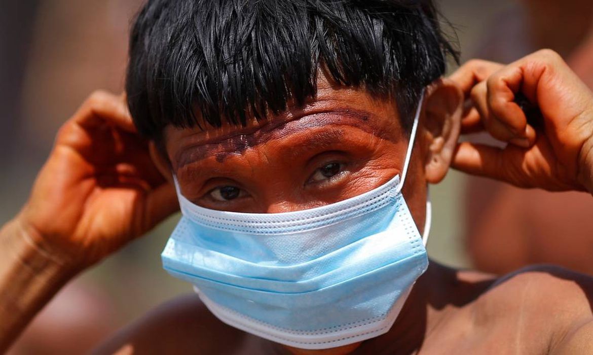 88669972 a man from the indigenous yanomami ethnic group holds his protective face mask amid the spr