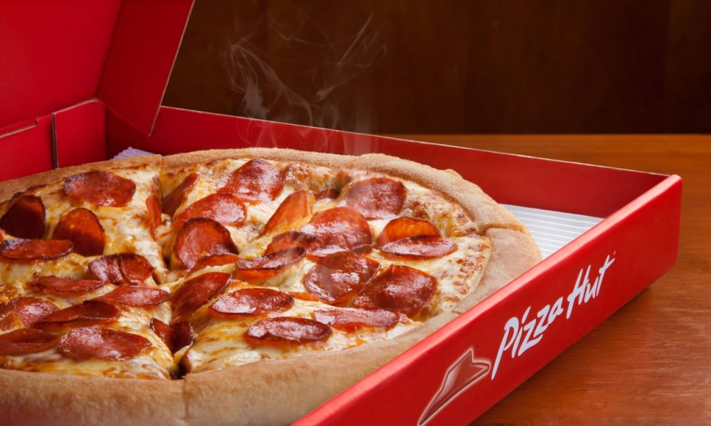 Imagem Ilustrando a Notícia: Anunciada fusão anuncia fusão da IMC com Pizza Hut e KFC no Brasil