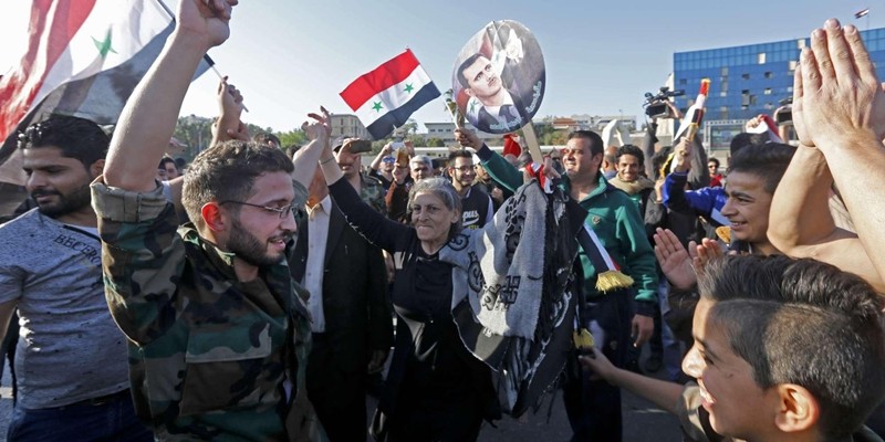 Imagem Ilustrando a Notícia: Sírios vão às ruas de algumas regiões para apoiar Assad