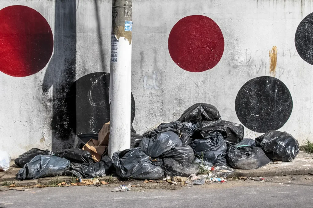 São Paulo, Brazil, December 22, 2015. Black bags of trash on street in Sao Paulo city
