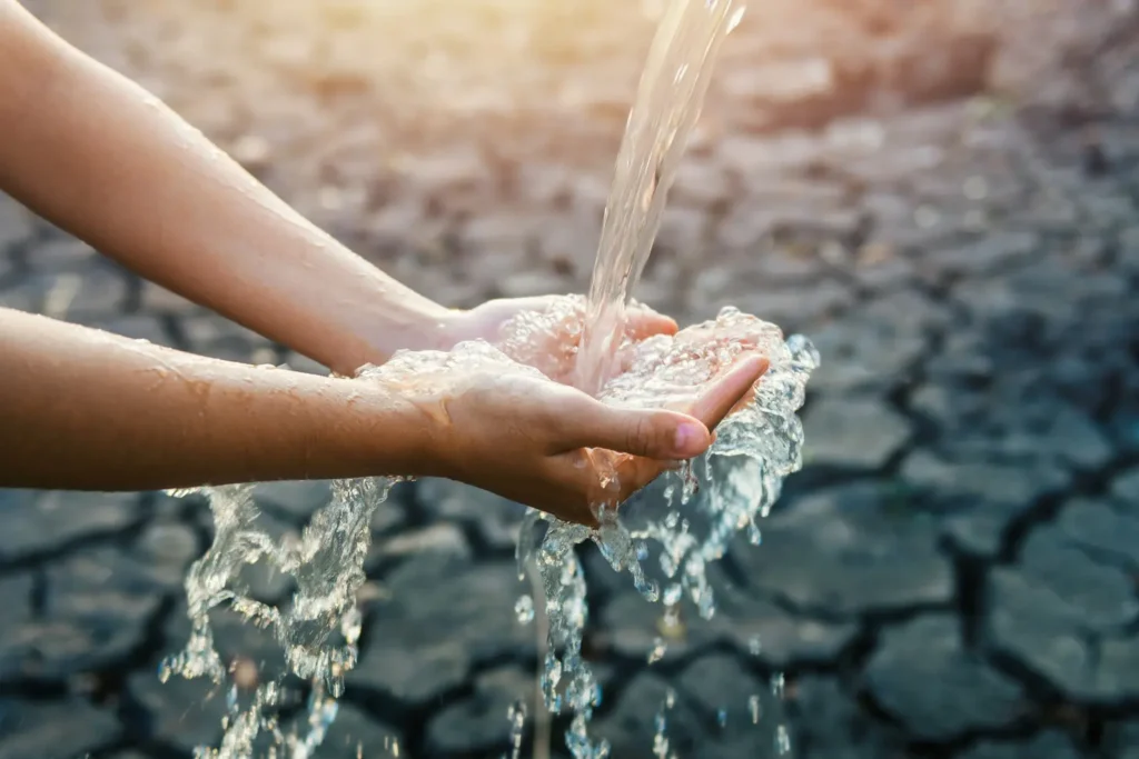 Water pouring on hand in morning ligth background