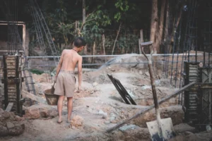 Poor children work in construction sites because of poverty, Child labor, human trafficking, World Day Against Child Labour concept.