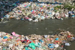 The Bagmati river running through Kathmandu in Nepal. The river is full of litter and raw sewage which is emptied into the river. The local people see the river as a rubbish collection service.