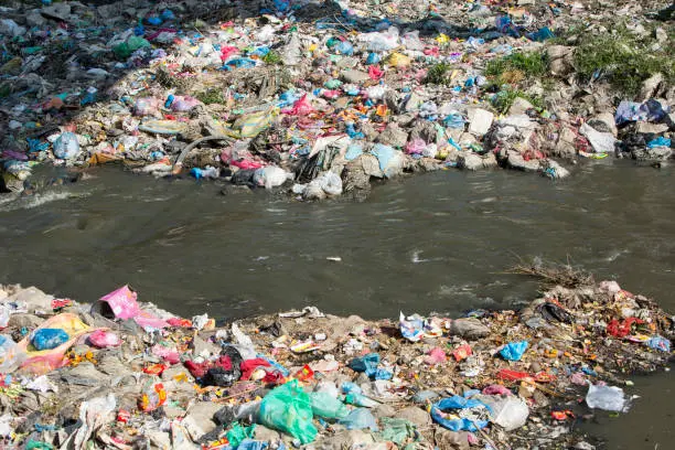 The Bagmati river running through Kathmandu in Nepal. The river is full of litter and raw sewage which is emptied into the river. The local people see the river as a rubbish collection service.