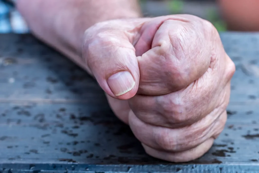 Hand of a man clenched to the fist
