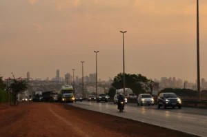 Evening traffic with Goiania cityscape