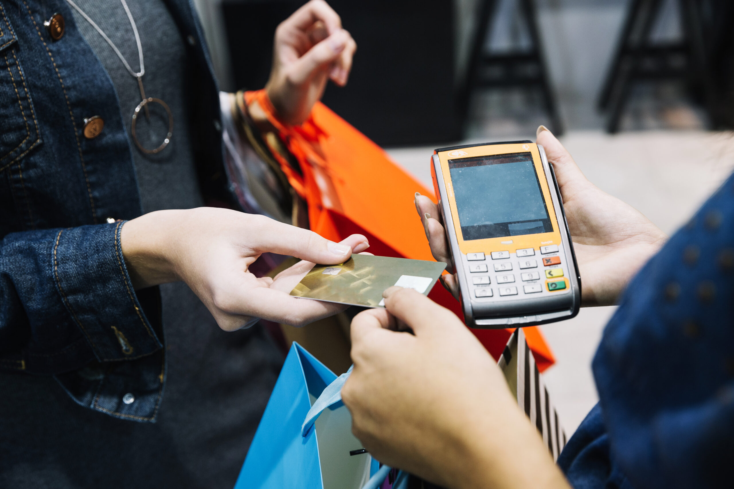 anonymous woman paying shop scaled 1