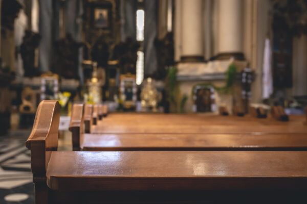 interior details catholic church with wooden benches scaled 1