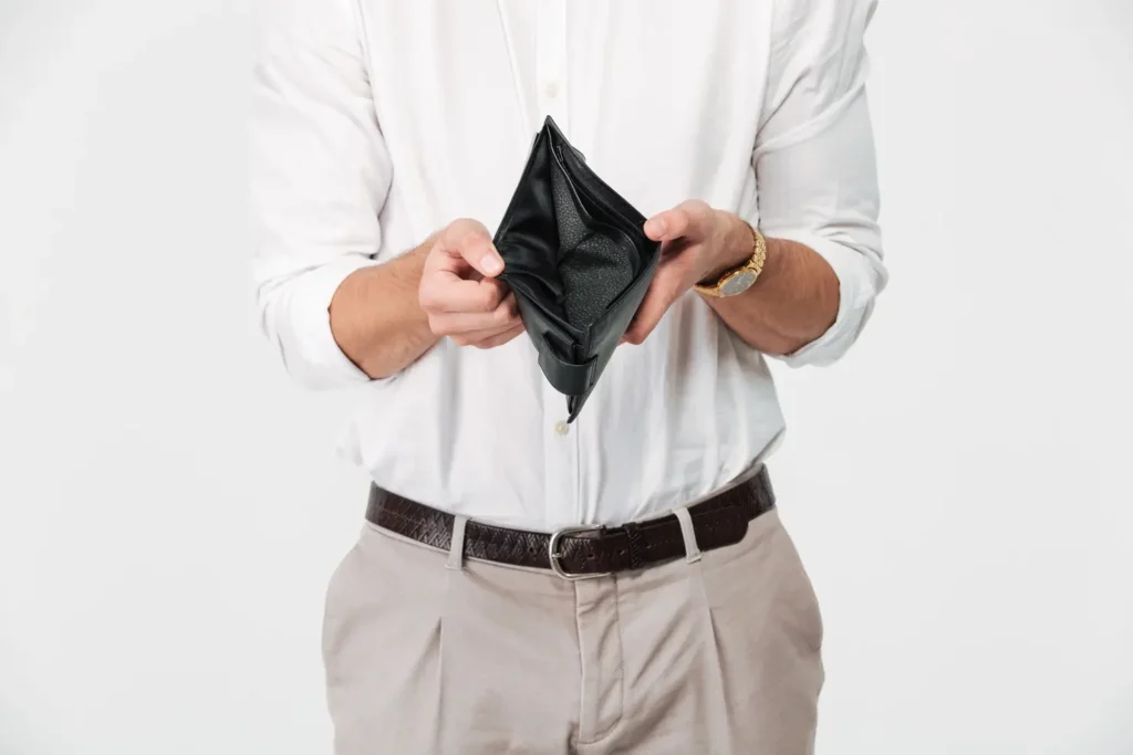 close up portrait man showing empty wallet