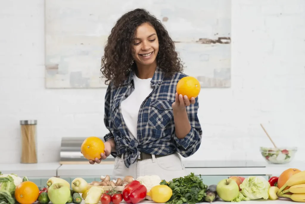 smiling woman looking delicious orange
