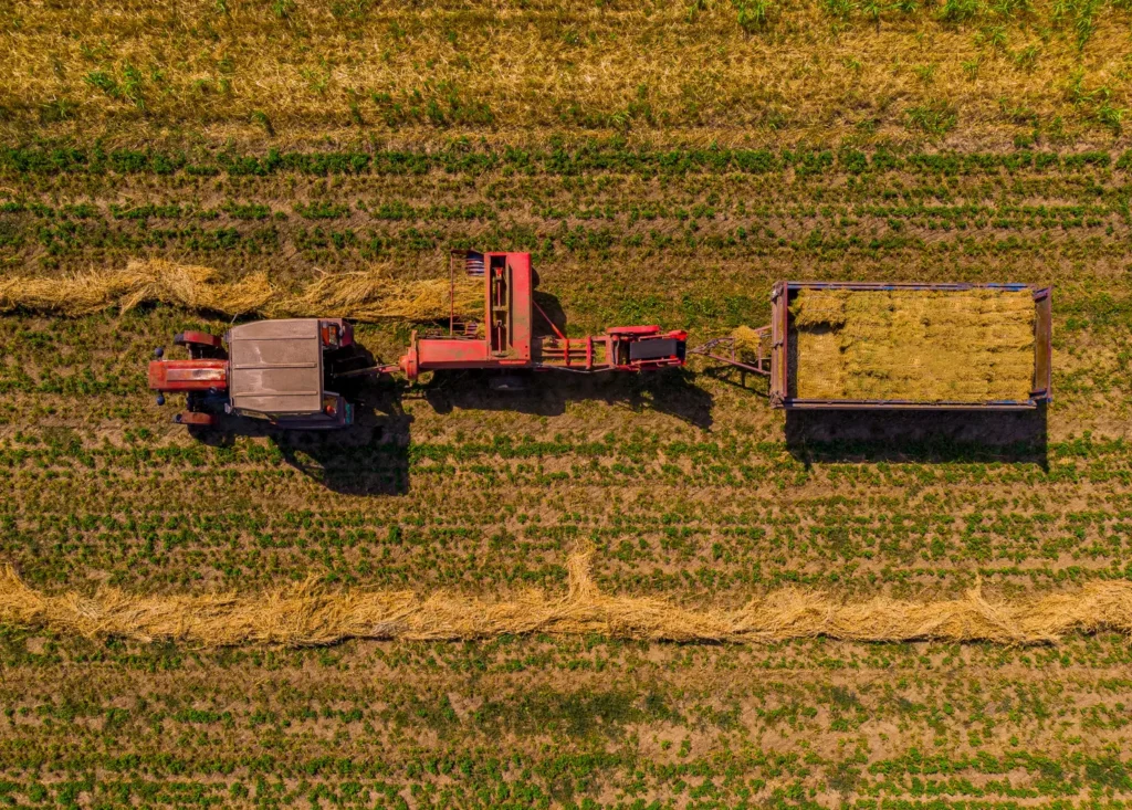 top view tractors doing harvest field